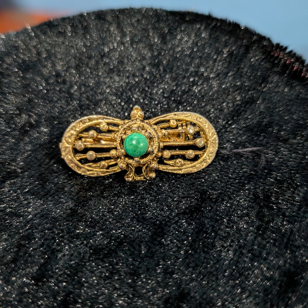 Elegant Gold and Green Brooch